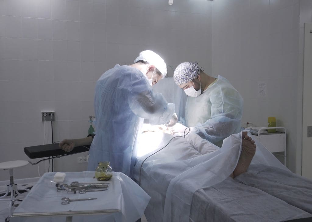 Doctors performing a circumcision in Malaysia.