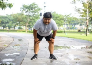 Blog 27 An overweight man experiencing a decline in endurance and physical performance due to low testosterone.